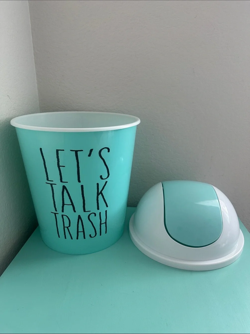 Essential Home Designs-basic plastic trash can with swinging top-new